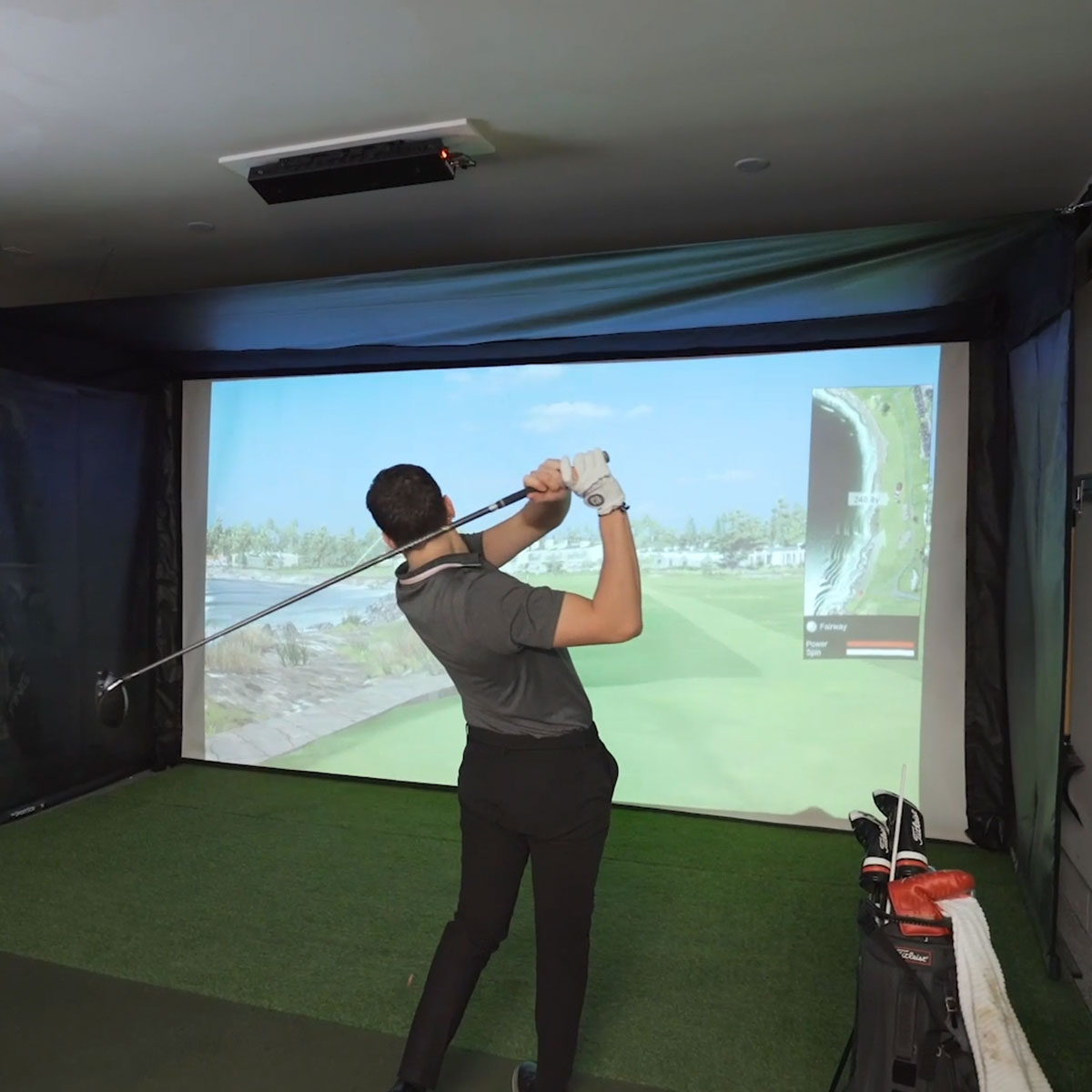 Blue Tees Golf Rainmaker SportScreen Vanish Retractable Golf Studio Complete Package | Home Golf Simulator Studio with Impact Screen, Enclosure, Hitting Mat, Putting Turf & Projector